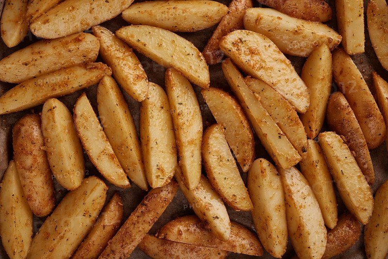 Roasted potatoes in the oven with spices and herbs