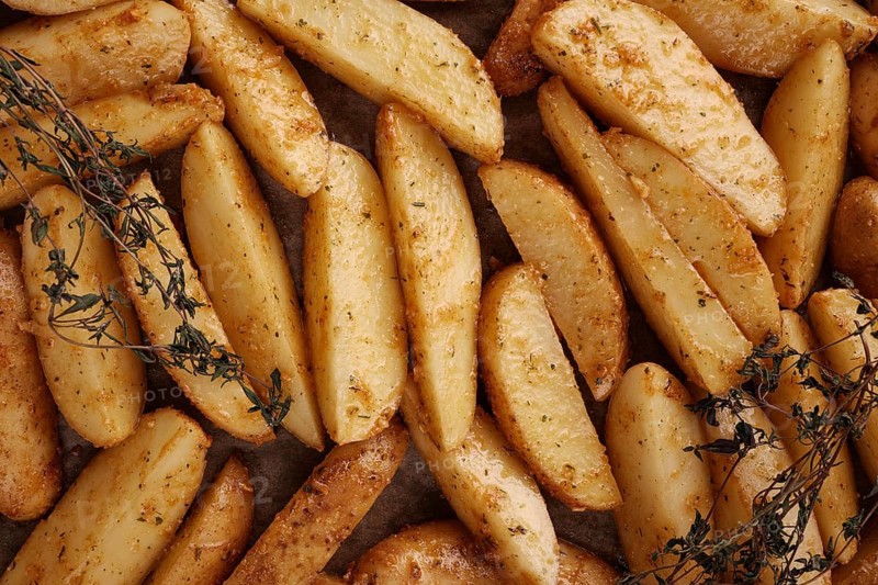 Roasted potatoes in the oven with spices and herbs