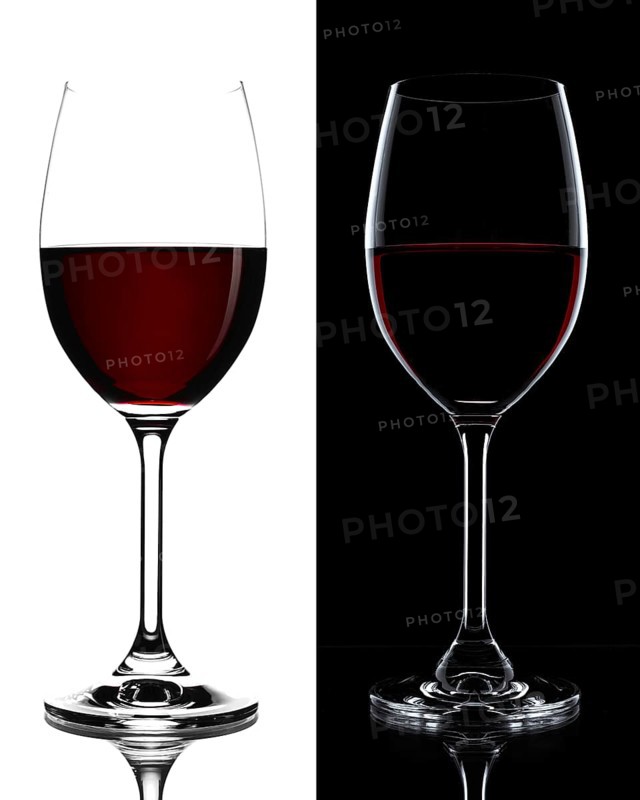 Red wine in a glass isolated on black and white background