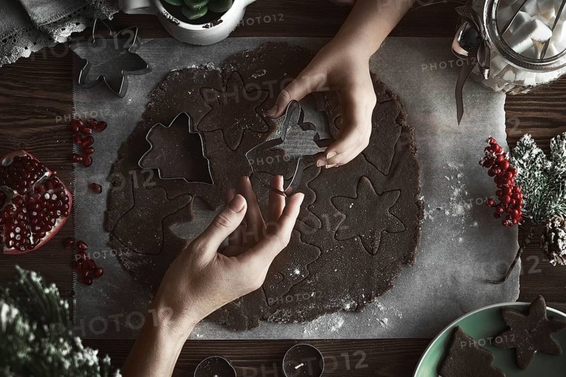 Preparing Christmas cookies. Dough on the table with baking dishes