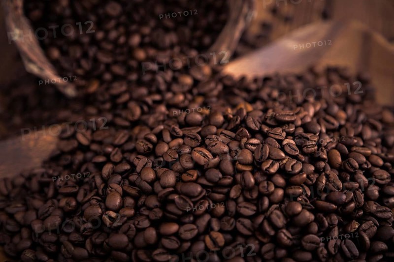 Roasted coffee beans close-up on a wooden surface