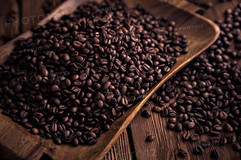 Roasted coffee beans close-up on a wooden surface
