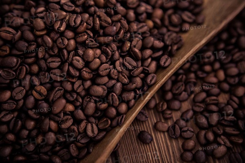 Roasted coffee beans close-up on a wooden surface