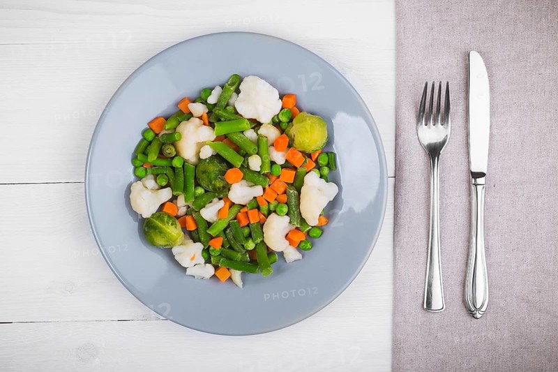 Delicious mix of vegetables on the plate. View from above