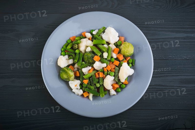 Delicious mix of vegetables on the plate. View from above