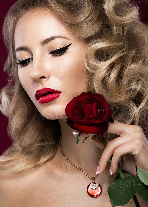 Beautiful blonde in a Hollywood manner with curls