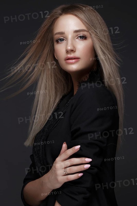 Beautiful woman with evening make-up and long straight hair