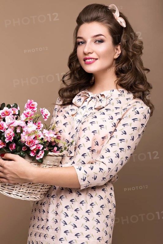 Fresh young girl in a light silk dress