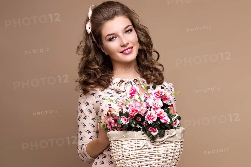 Fresh young girl in a light silk dress