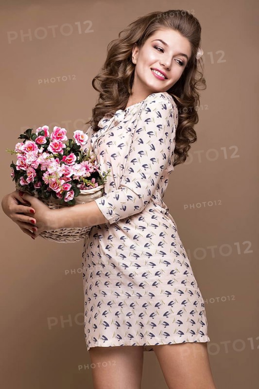 Fresh young girl in a light silk dress