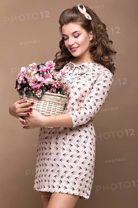 Fresh young girl in a light silk dress
