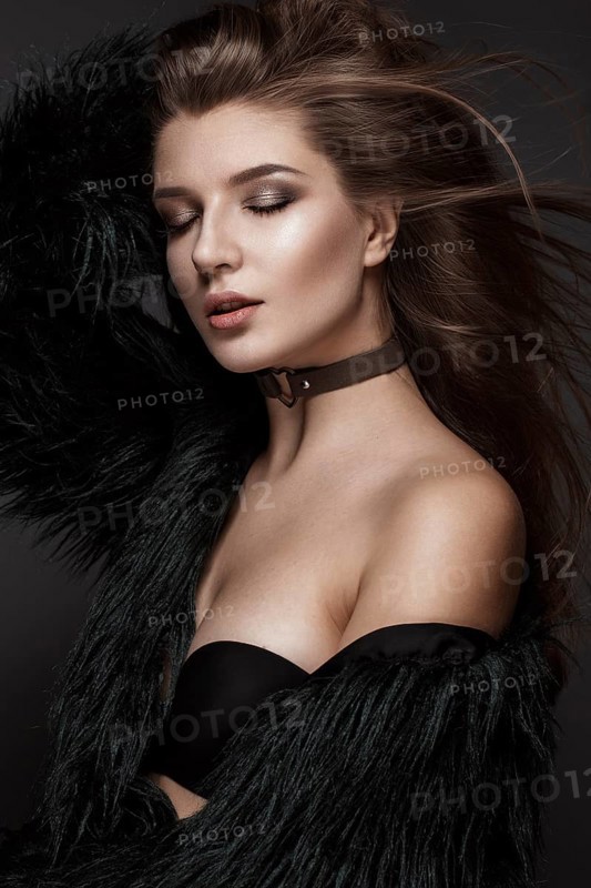 Beautiful woman with evening make-up and long straight hair