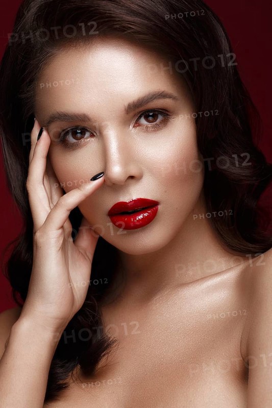 Beautiful girl in Hollywood image with wave and classic makeup. Beauty face. Photo taken in the studio