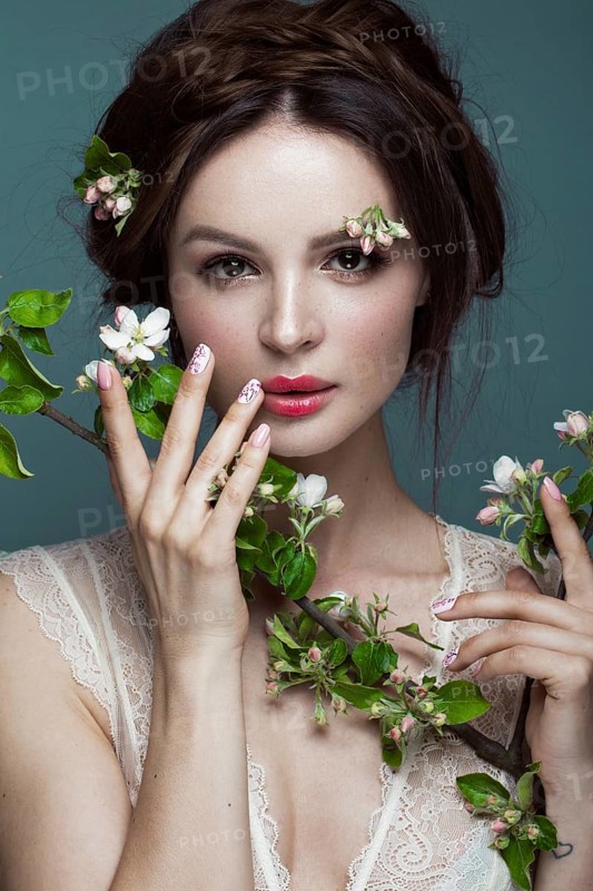 Beautiful brunette girl in lingerie with a gentle romantic make-up
