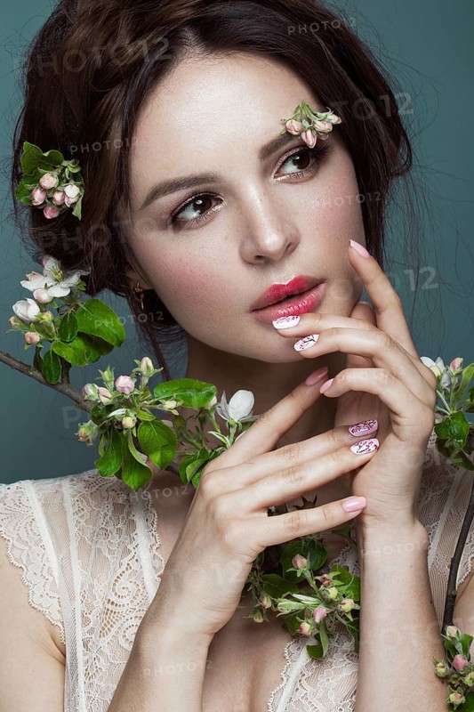 Beautiful brunette girl in lingerie with a gentle romantic make-up