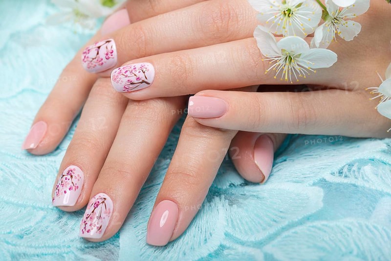 Spring manicure for the bride in gentle tones with flowers. Nail Design