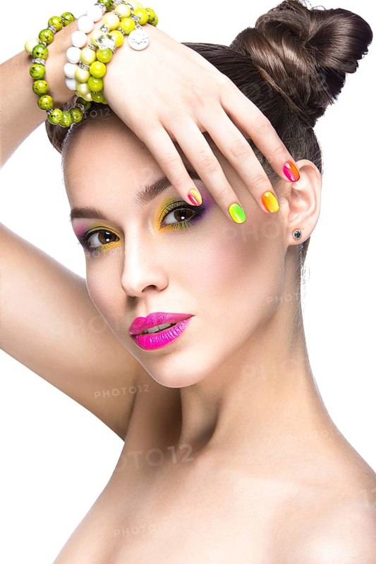 Beautiful girl in pink sunglasses with bright makeup and colorful nails. Beauty face. Picture taken in the studio on a white background