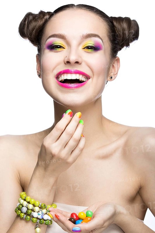 Beautiful girl in pink sunglasses with bright makeup and colorful nails. Beauty face. Picture taken in the studio on a white background