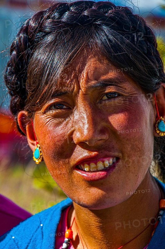 Friendly tibetan woman in the town of Ali