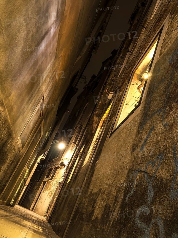 Narrow alley with lantern in Venice