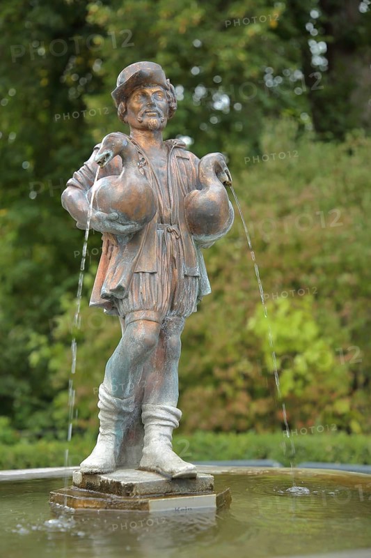 Man carrying two geese with water jet