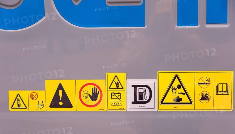 Warning signs on construction machinery