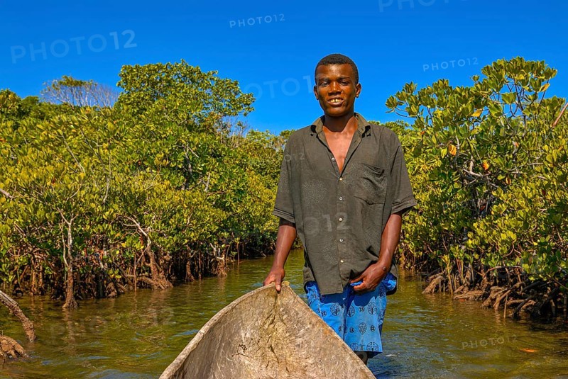 Man paddling through the mangroves of the Island Ile Sainte-Marie although Nosy Boraha