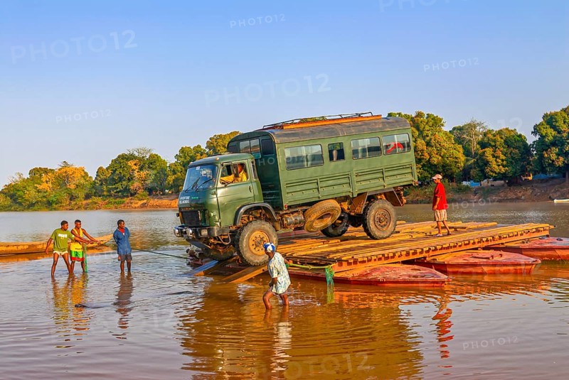 Truck crossing on a improvised ferry the Manambolo river