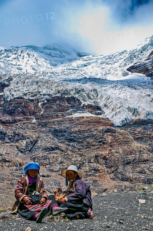 Pilgrims taking a break on the Karo-La Pass along the Friendship Highway