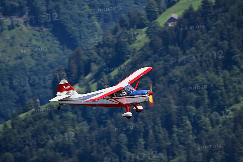 Vintage aircraft Stinson Voyager 108-2 in flight