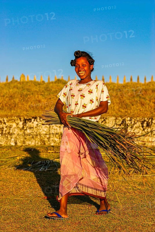 Friendly young woman with red in her hands