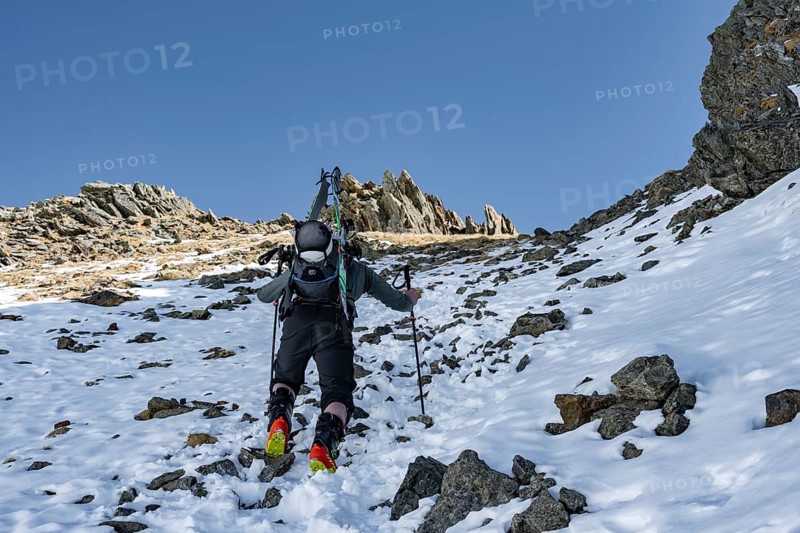 Ski tourers on the ascent in a saddle