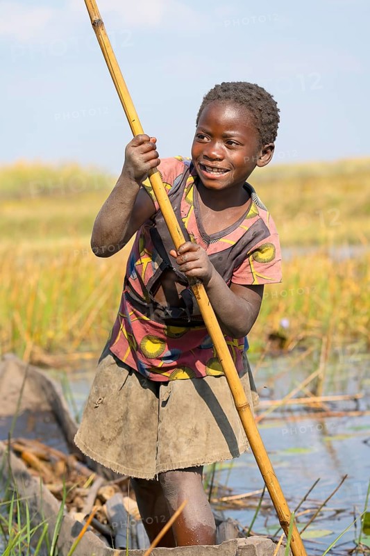 Smiling girl on canoe