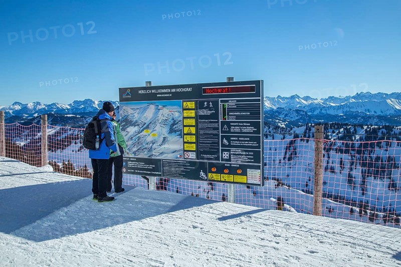 Senior holidaymaker couple looking at panorama map
