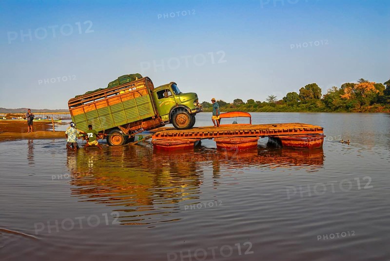 Truck crossing on a improvised ferry the Manambolo river