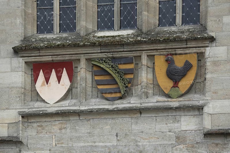 Three coats of arms
