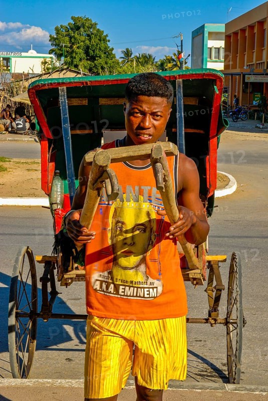 Man running with his walking rickshaw