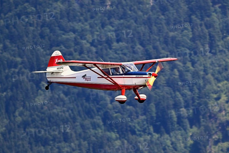 Vintage aircraft Stinson Voyager 108-2 in flight