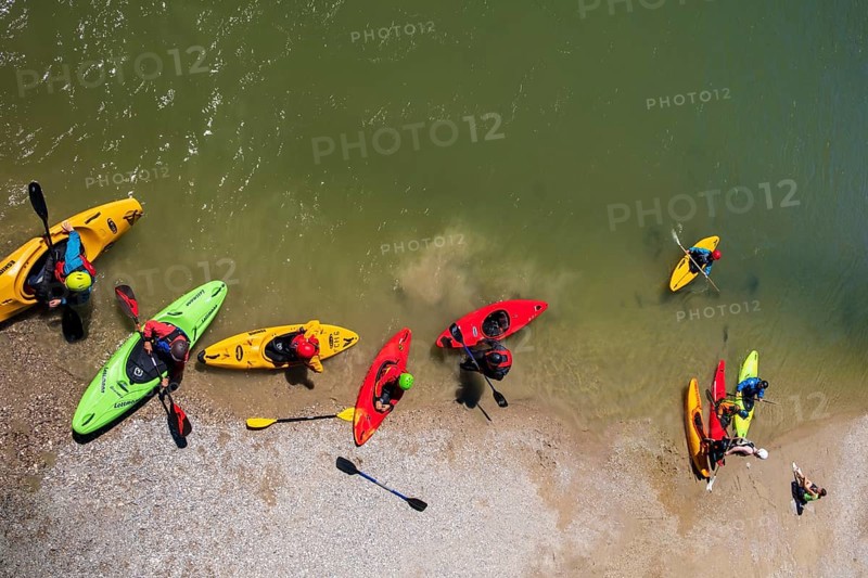 Kayakers at the Marienbruecke over the Isar