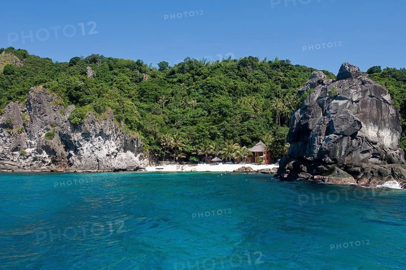 View of small white beach sandy beach of Apo Island in Philippine Sea off Negros Island