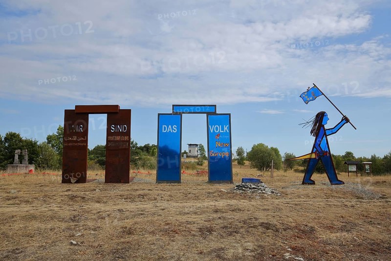 Sculpture with inscription We are the people and blue Indian