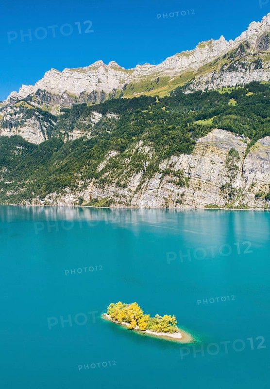 Aerial view of Lake Walen with a view of Chive Island in the turquoise water and mountains with Leistchamm in the background