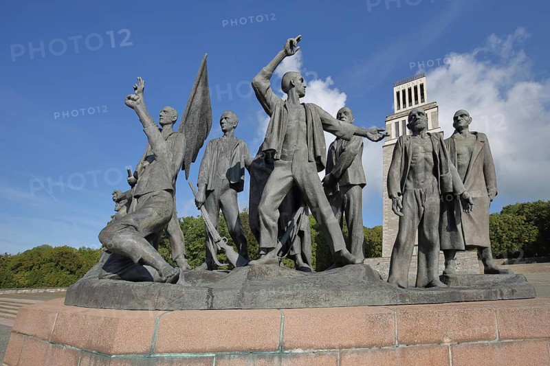 Group of figures by Fritz Cremer with bell tower