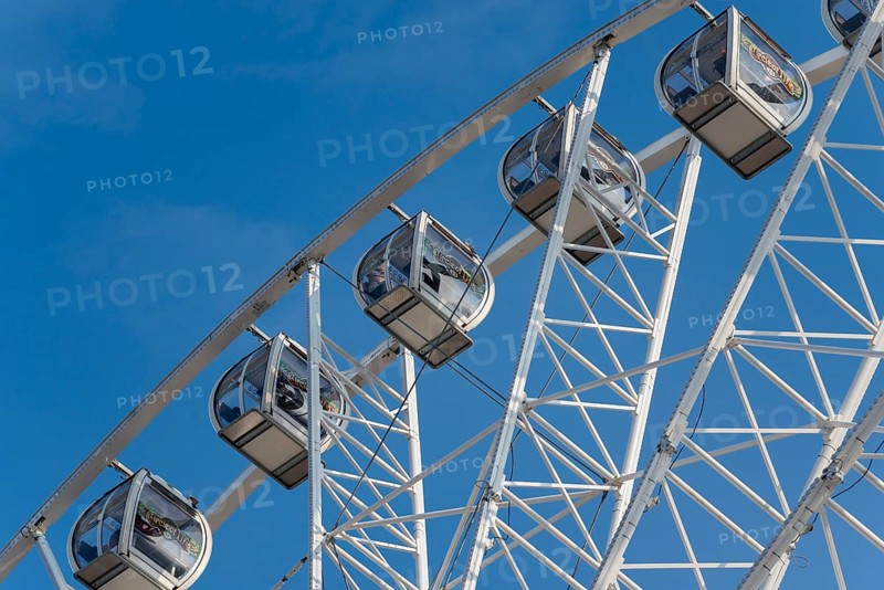 Gondolas of a Ferris wheel at the harbour