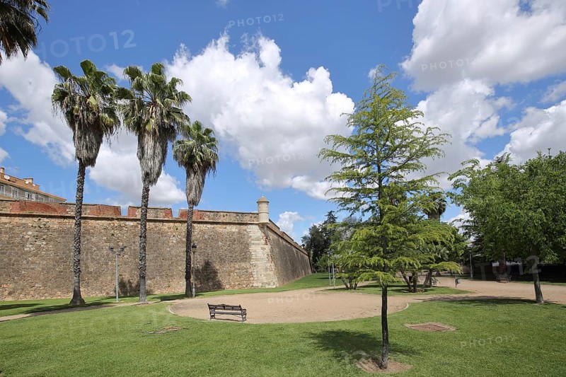 Historical fortification Baluarte de la Trinidad and park with palm trees