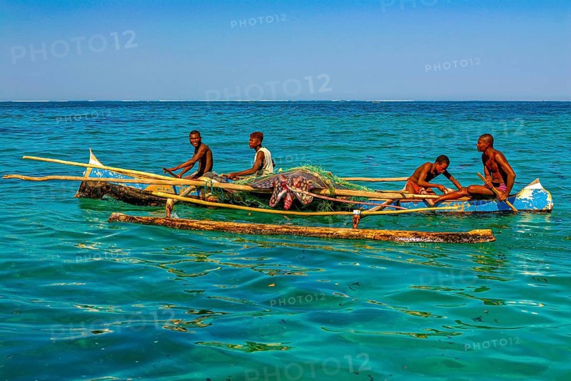 Traditional sailing boat and rowing boat with a dead