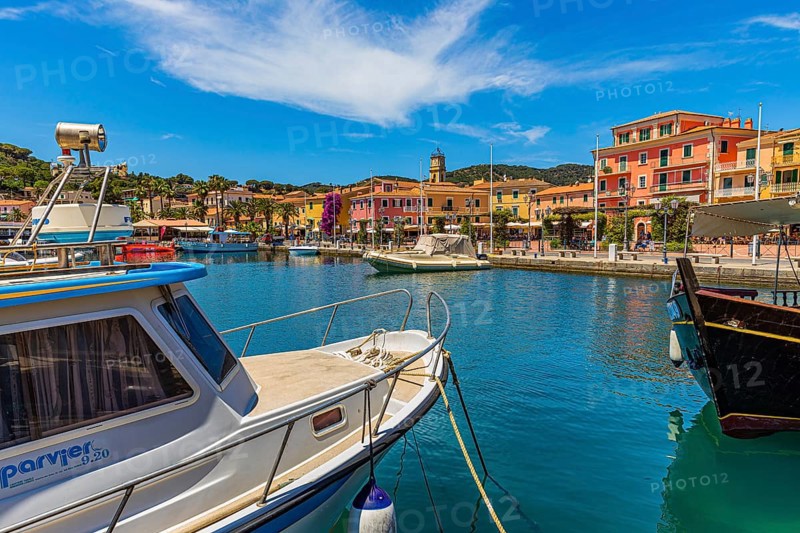 Boats anchor in the harbour of Porto Azzurro