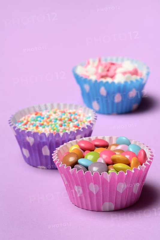 Chocolate lentils and love beads in paper moulds