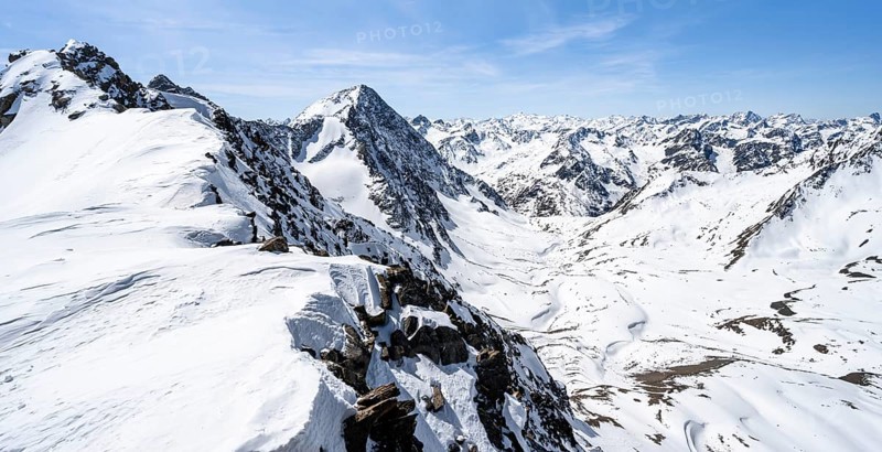 Mountain panorama of the Stubai Alps in winter with Schrankarkogel peak