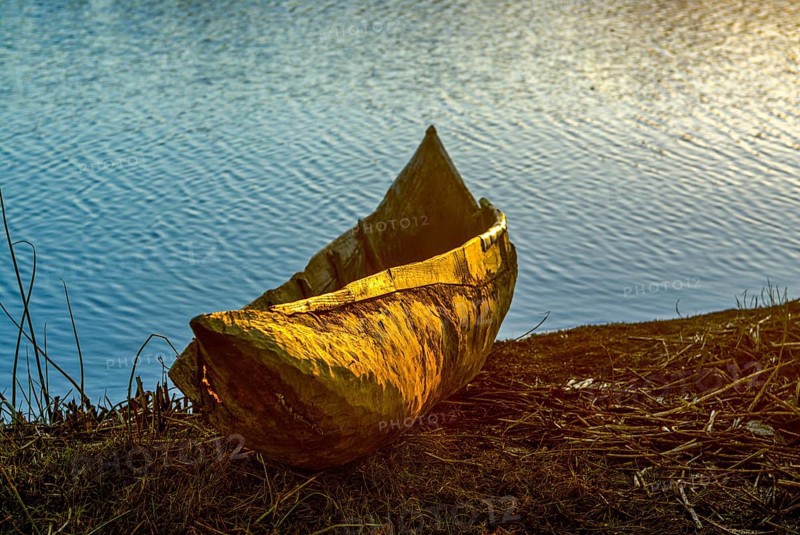 Wooden canoe at sunset